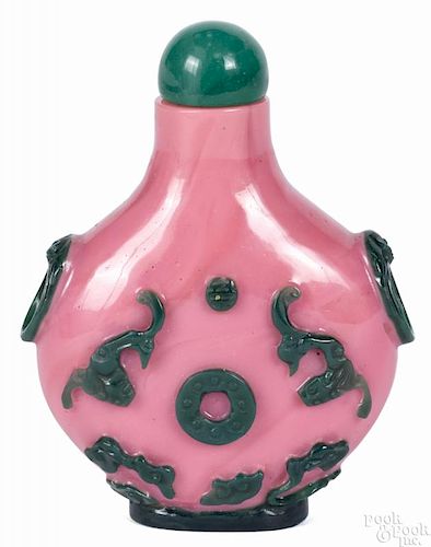 Chinese snuff bottle with green bats, cut to pink, 3'' h.