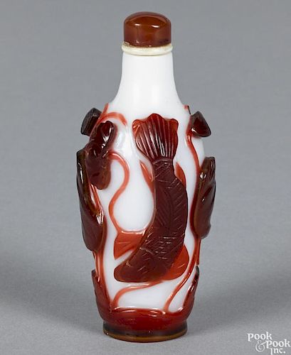 Chinese snuff bottle with a red lotus, cut to white, 3 1/4'' h.