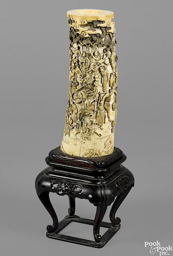 Japanese carved ivory tusk, late 19th c., signed by Yoshiaki, the exterior profusely carved