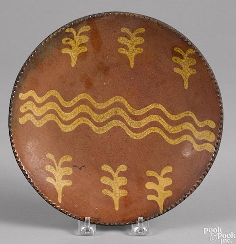 Pennsylvania redware pie plate, 19th c., with slip decoration, 9'' dia.