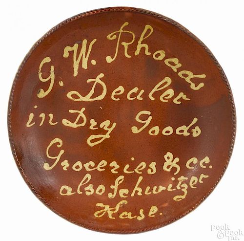 Southeastern Pennsylvania redware advertising charger, mid 19th c.