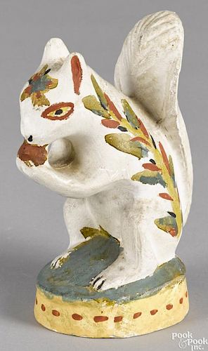 Pennsylvania painted chalkware squirrel, 19th c., retaining a vibrant polychrome surface
