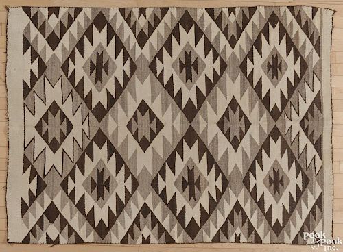 Navajo weaving, early 20th c., 67'' x 49''.
