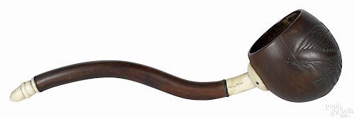 Sailor's mahogany, ivory, and coconut ladle, 19th c., the bowl carved with an American eagle