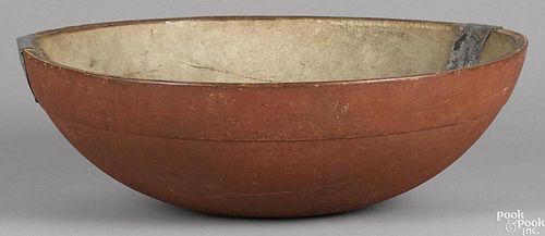 Large turned and painted bowl, 19th c., retaining an old red surface and make-do crack repair