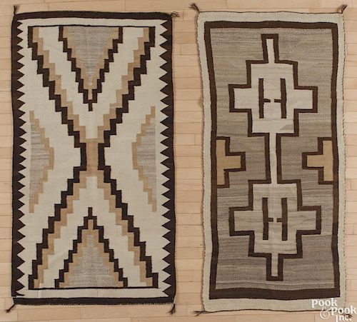 Two Navajo weavings, early 20th c., 68'' x 32'' and 66'' x 36''.