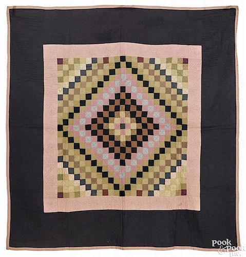 Lancaster County, Pennsylvania Amish sunshine and shadows wool quilt, late 19th c., with basket