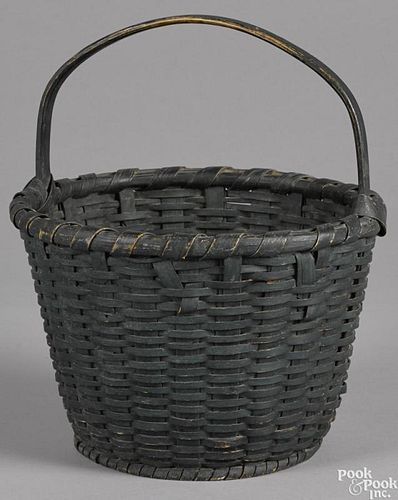 Painted split oak basket, 19th c., retaining an old green surface, 13'' h.