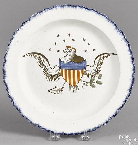 Pearlware blue feather edge plate, 19th c., with an American eagle decoration, 9 3/4'' dia.