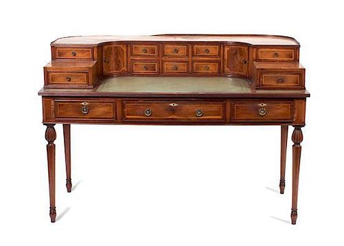* A Yew Wood Carlton House Desk Height 37 1/2 x width 54 1/2 x depth 27 1/2 inches.