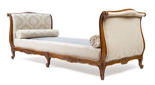 A Louis XV Style Walnut Daybed Height 34 x interior width of seat 75 x depth 37 1/2 inches.