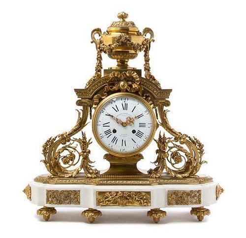 * A French Gilt Bronze and Marble Mantel Clock Height 23 inches.