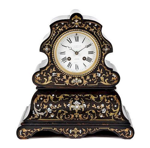 * A French Brass and Mother-of-Pearl Inlaid Mantle Clock Height 12 inches.