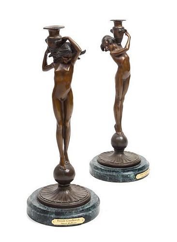 A Pair of American Bronze Figural Candlesticks Height of first 17 1/2 inches,