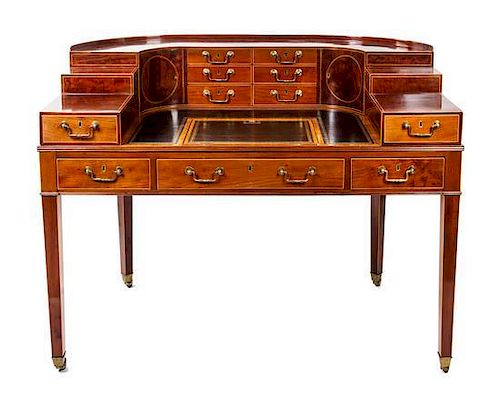 * A George III Gilt-Tooled Leather-Inset, Inlaid Mahogany and Satinwood-Banded Carlton House Desk Height 41 x width 53 1/2 x dep