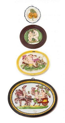 * Four Ceramic Wall Plaques Width of widest 9 1/4 inches.