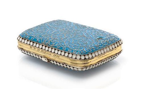 * A Russian Enameled Silver Box, Moscow, late 19th century, the case with a light blue enameled ground and filigree scrolls thro