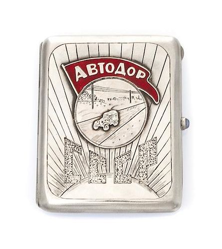 * A Russian Silver and Enamel Cigarette Case, Maker's mark AO, of rectangular form, the lid centered by an applied roundel decor