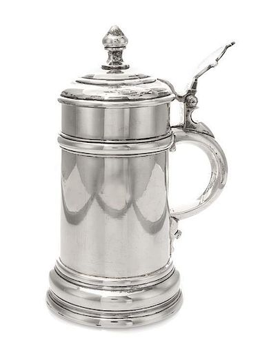 A Russian Silver Tankard, Maker's mark XK, Moscow, 1897, of cylindrical form with a baluster finial and a stepped foot.