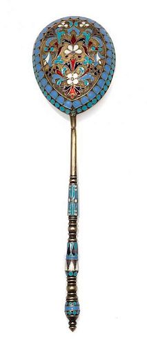 * A Russian Enameled Silver Spoon, , the back of the bowl worked with polychrome rinceau scrolls against a textured ground with