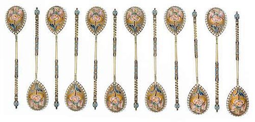 * A Set of Twelve Russian Silver-Gilt and Enamel Spoons, Mark of Ivan Saltykov, Moscow, Late 19th century, each having a twist h