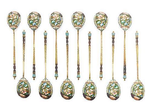 * A Set of Twelve Russian Silver and Enamel Spoons, Mark of 20th Artel, Moscow, early 20th century, each having an enameled fini