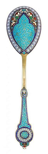 * A Russian Silver-Gilt and Enamel Serving Spoon, Mark of Antip Kuzmichev, Moscow, late 19th/early 20th century, the handle and