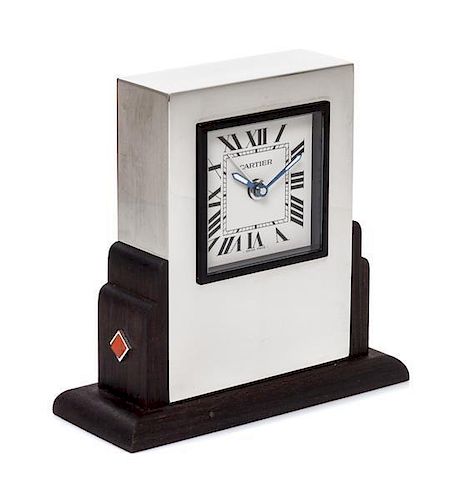 A Cartier Art Deco Style Travel Alarm Clock Height 3 1/2 x width 3 3/8 x depth 1 3/8 inches.