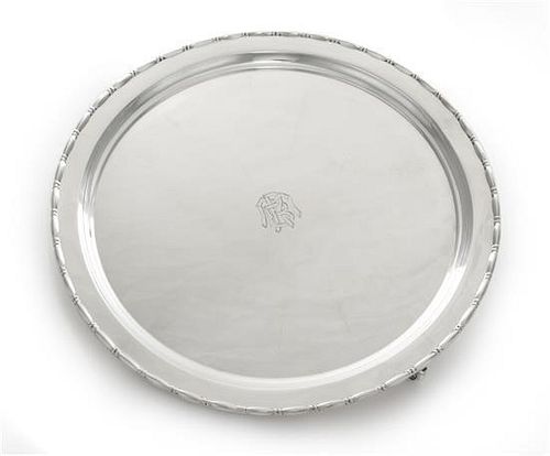 * An American Silver Salver, Reed & Barton, Taunton, MA, First half 20th century, of shaped circular form raised on three openwo