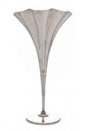 An American Silver Trumpet Vase, Tiffany & Co., New York, NY, having an undulating rim and a beaded base.