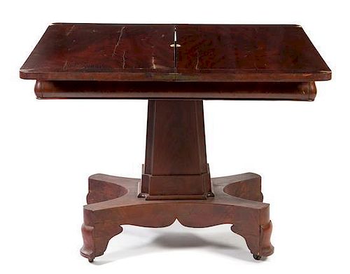 * An American Empire Mahogany Flip-Top Game Table Height 28 x width 36 x depth 18 inches (closed).