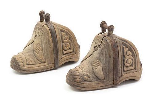 * A Pair of Argentinean Metal Mounted, Carved Wood Stirrups Length 9 inches.