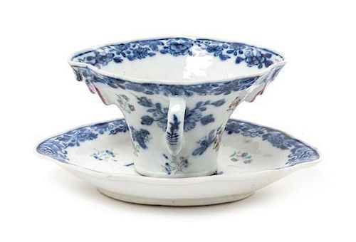 A Chinese Export Blue and White Porcelain Rhyton Cup and Underplate Width of saucer 6 3/4 inches.