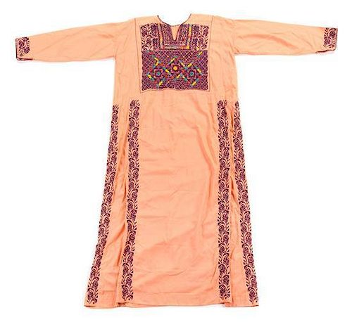 * A Palestinian Embroidered Dress Length of first mentioned 53 3/4 inches.