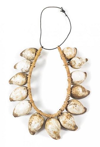 * An Indonesian Men's Egg Cowry Shell Necklace Overall length approximately 20 inches.