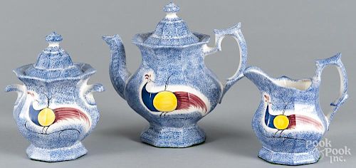 Reproduction blue spatter teapot, sugar, and creamer.