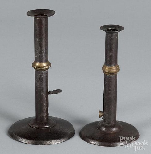 Two hogscraper candlesticks, 19th c., with brass wedding bands, 7 1/4'' h. and 8'' h.