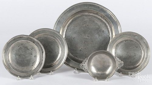English pewter deep dish, 19th c., 13 1/4'' dia., together with three plates and a porringer.