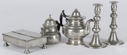 Pewter tablewares, 19th c., to include a pair of candlesticks, two teapots, and a standish