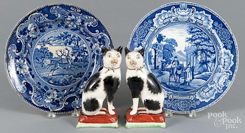 Two blue Staffordshire plates, 19th c., 10 1/4'' dia., together with a pair of cats, 7'' h.