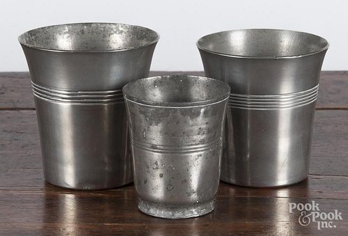 Two pewter beakers, 19th c., 4'' h., together with a small cup, 3'' h.