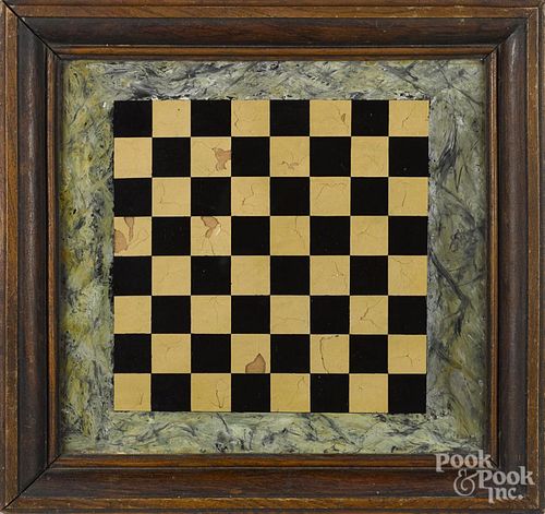 Reverse painted gameboard on glass, 19th c., in its original pine frame, 10 1/4'' x 10 1/2''.
