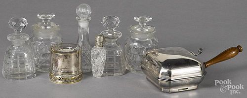 Two pieces of silver plate, together with five colorless glass bottles