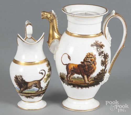 Paris porcelain teapot and pitcher, mid 19th c., decorated with a lion and hyena, 9 1/2'' h.