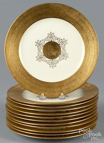 Set of twelve Rosenthal porcelain plates with gilt decoration of a woman playing a pianoforte