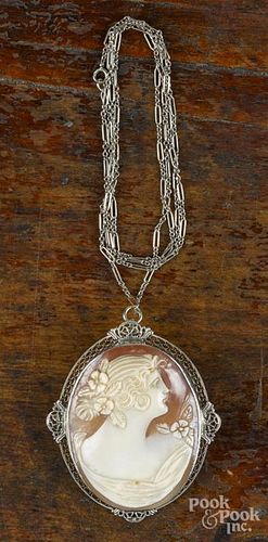 Large shell cameo pendant/brooch with a 14K white gold filigree frame and a 14K white gold chain
