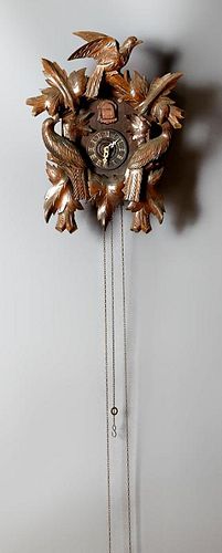 Two German Cuckoo Clocks, 20th c., with weights, L