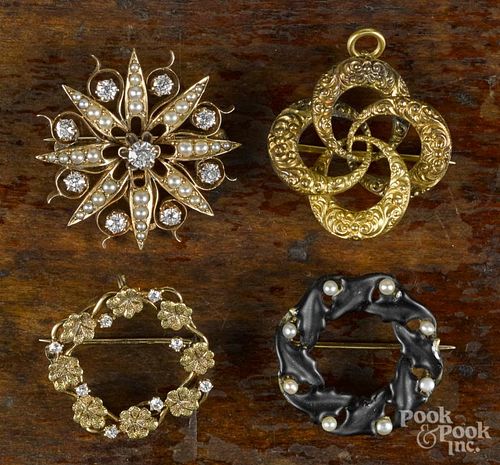 Four yellow gold pins, to include a Victorian 14K knot watch pin, a 14K circular wreath pin