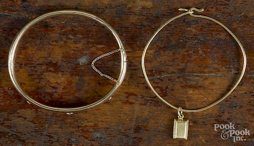 14K yellow gold bangle bracelet, inset with three small diamonds, 2 5/8'' dia.
