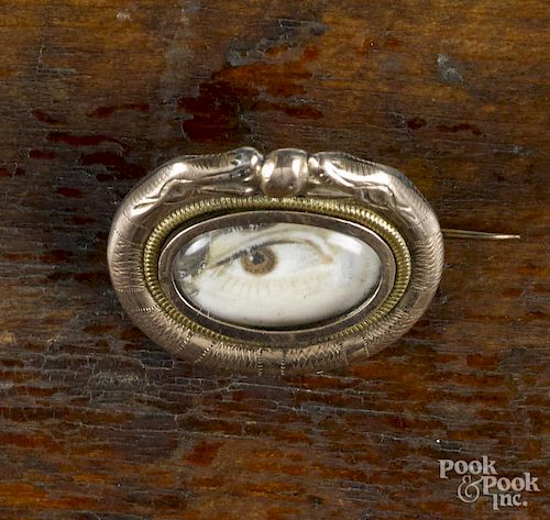 Lover's Eye brooch, 19th c., with a hand painted woman's eye under crystal